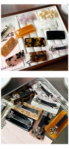 Detail of handmade acetate hair clips with metal spring back in tortoise and marble patterns