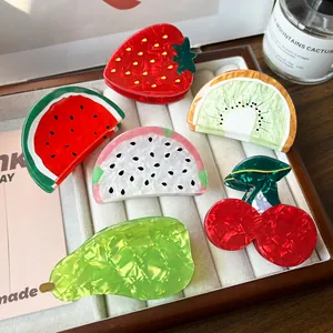 Set of fruit shaped hair claws including watermelon and strawberry made of pearly acrylic