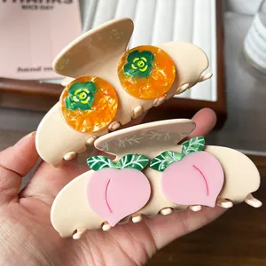 Cute acetate fruit shark hair clips featuring orange persimmon and pink peach designs