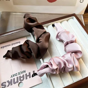 Elegant satin pleated banana hair clips in coffee and dusty rose for women's ponytails