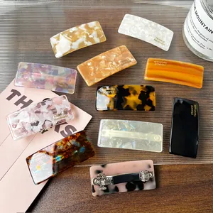 Handmade acetate spring hair clips with tortoiseshell and marble patterns in various colors
