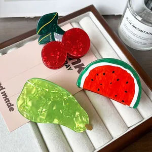 Three-piece fruit hair claw clips featuring cherry, watermelon, and pear acetate designs
