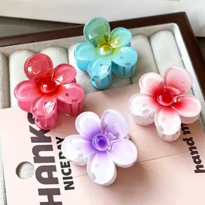 Set of four flower shark hair clips in macaron and gradient colors with resin finish