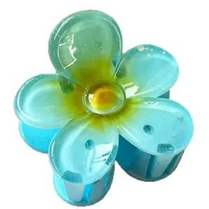 Lake blue and yellow floral hair claw clip in translucent finish on white background