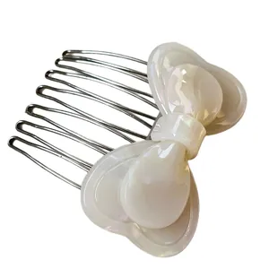 Elegant 7-tooth metal hair comb with large iridescent white resin bow for women