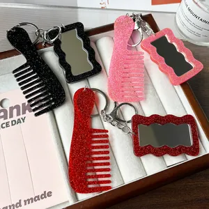 Sparkly acrylic heart mirror and comb keychain set in red, pink, and black glitter