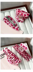 Detailed view of pink leopard print hair claw clips and acetic acid resin hair accessories