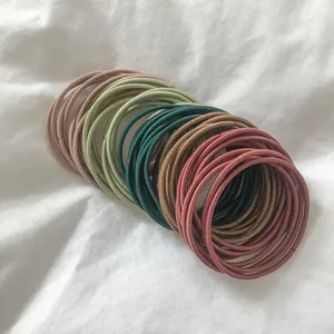 Macro shot of assorted Morandi colors high elastic hair ties with woven fabric texture