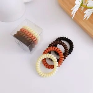 Set de gomas de pelo en espiral tonos tierra con caja de almacenamiento transparente