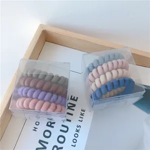 Set de gomas de pelo en espiral mate en colores Morandi en cajas de plástico transparente