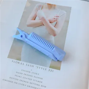 Detail of lavender hair root clip with comb teeth on a fashion magazine background
