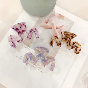 Lot de 3 pinces à cheveux en acétate ondulées motifs marbré violet et écaille de tortue chic