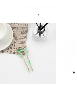 Detailed macro view of an elegant marble-textured acetate butterfly hair pin for women