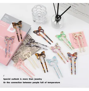 Detailed close-up of marble pattern acetate butterfly hair pin with elegant U-shape fork