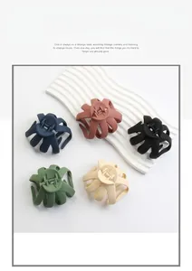 Close-up of matte octopus claw hair clips in five colors with multi-tooth grip detail