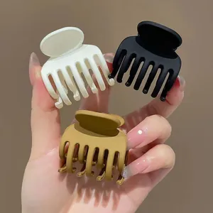 Set di 3 mollette opache nero, bianco e kaki per acconciature a coda di cavallo alta