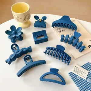 9-piece set of matte Klein blue hair claws and clips in various geometric shapes