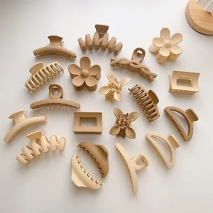 Matte finish hair claw clips set in earth tones including beige, tan and milk tea colors