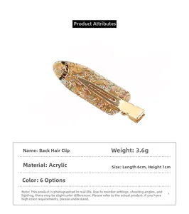 Makroaufnahme der bernsteinfarbenen Haarklammer mit Glitzer und goldenem Metallclip