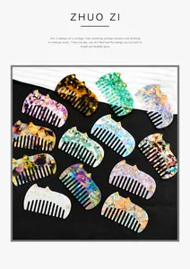 Detail of cute cat-shaped acetate hair combs with marble and tortoiseshell patterns