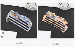 Close-up of vintage cat-ear acetate hair combs in marble blue and amber textures