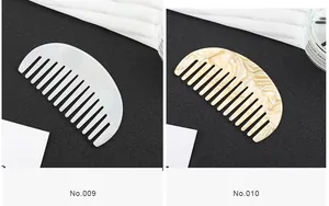 Detail view of pearl white and marble beige acetate wide-tooth combs on black surface