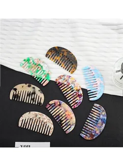 Various acetate hair side combs with tortoiseshell and marble patterns on silk fabric