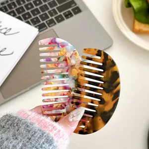 Acetate geometric half-round hair combs in marble and tortoiseshell patterns