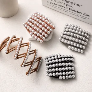 Close-up of elegant foldable pearl headbands in various colors on a stylish background