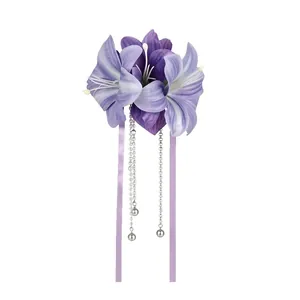 Elegant purple fabric lily flower hair clip featuring long pearl tassels and ribbons