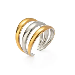 Minimalist multi-layered open ring in two-tone gold and silver finish with sleek metal arcs