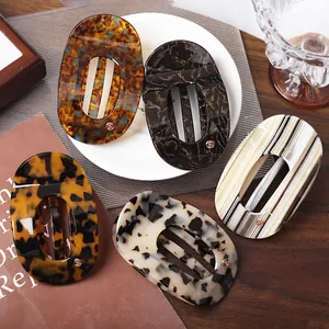 Five assorted marble patterned acetate hair claws with elegant semi-circle design