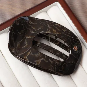 Elegant semi-circular acetate hair claw clip with dark marble tortoiseshell pattern
