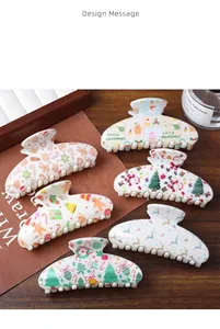 Detail of Christmas claw clips set featuring Santa, tree and reindeer patterns