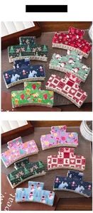 Detailed view of colorful Christmas hair claws with festive cartoon patterns and patterns