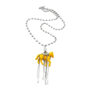 Playful yellow resin horse pendant necklace with silver bead chain and elegant tassels