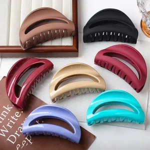 Minimalist semi-circular hollow hair claws in various matte and glossy solid colors