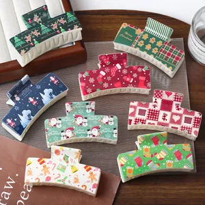 Set of 8 Christmas themed plastic hair claws with reindeer, snowman and Santa patterns