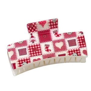 Christmas themed rectangular plastic hair claw clip with festive plaid and holiday patterns