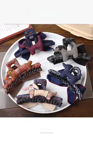 Detailed set of fabric Scottish Terrier claw clips with premium bow and plaid patterns