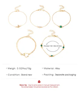 Detailed view of 5 bohemian gold-tone anklets with size and weight specifications