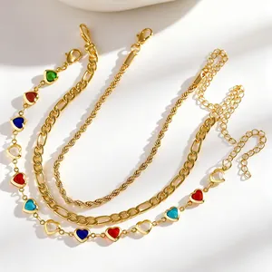 Detailed view of a 3pcs gold anklet set with colorful heart charms and layered chains.
