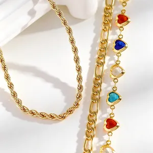 Detail of 3-piece bohemian anklet set with colorful heart stones and gold chains