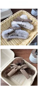 Detailed view of plush autumn flower hair claws with soft ribbon bows in multiple colors