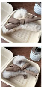 Close-up of cream plush bow claw clip featuring soft faux fur for autumn winter hairstyles