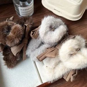 Plush bow hair claw clips in coffee, grey, and beige colors for autumn and winter styles