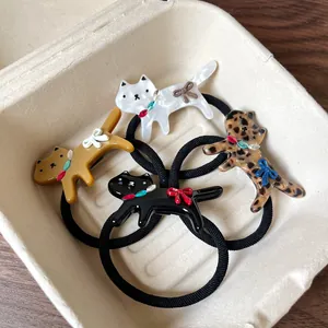 Set of 4 cute leopard and cartoon cat hair ties with high elasticity and crystal accents