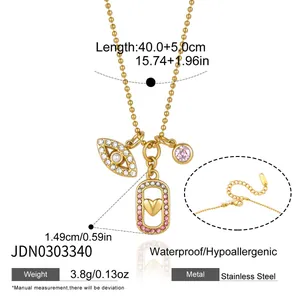 Stainless steel necklace with evil eye and heart charms in gold finish.