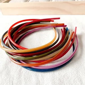 Close-up of colorful thin candy-colored headbands with non-slip teeth detail