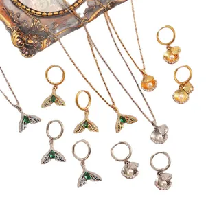 Elegantes Schmuckset im Ozean-Stil mit Meerjungfrauenschwanz und Muschelperlen-Design.